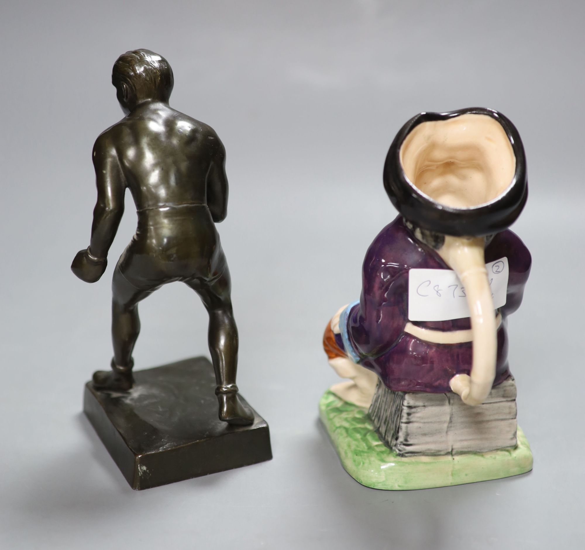 A metal patinated figure of a boxer, height 20cm, and a Melba ware character jug